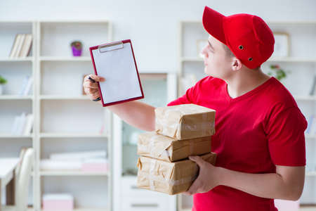 Post man delivering a parcel packageの写真素材