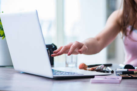 Fashion blogger with make-up accessoriesの写真素材