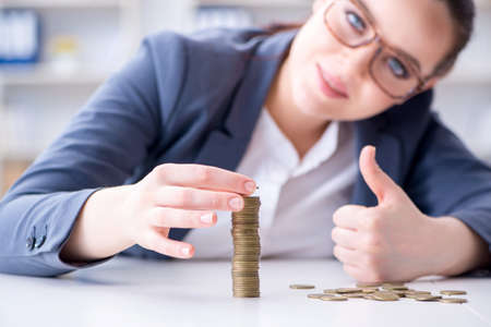 Businesswoman with coins in forex concept