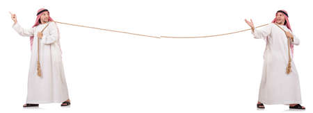 Arab in tug of war concept on whiteの写真素材