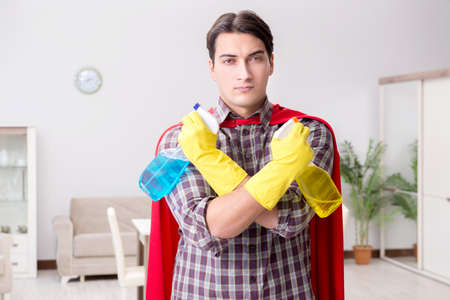 The super hero cleaner doing houseworkの写真素材