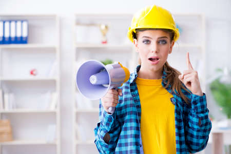 Angry building supervisor with megaphoneの写真素材