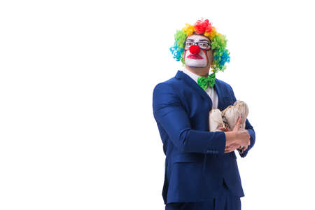 Funny clown businessman with money sacks bags isolated on whiteの写真素材
