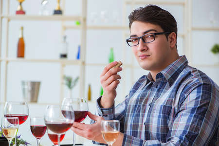 Professional sommelier tasting red wineの写真素材