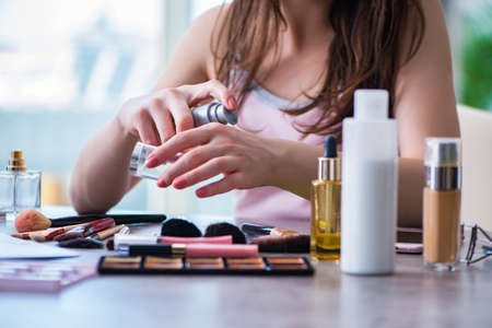 Woman with make-up accessories in beauty conceptの写真素材