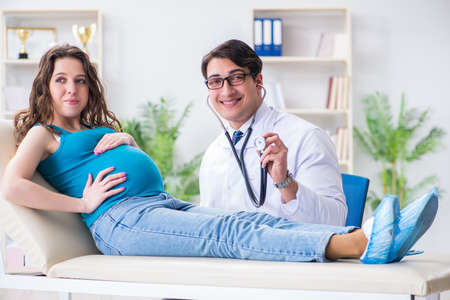 Pregnant woman visiting doctor in medical concept