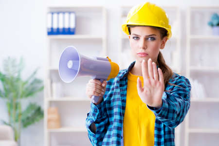 Angry building supervisor with megaphoneの写真素材