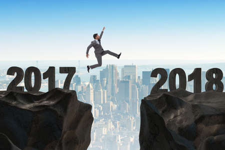 Businessman looking forward to 2018 from 2017の写真素材