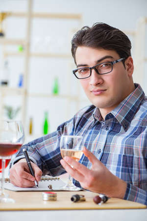 Professional sommelier tasting red wineの写真素材