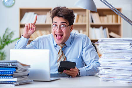 Funny accountant bookkeeper working in the officeの写真素材