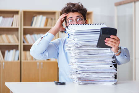 Funny accountant bookkeeper working in the officeの写真素材