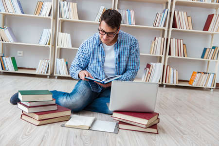 Young student studying with books