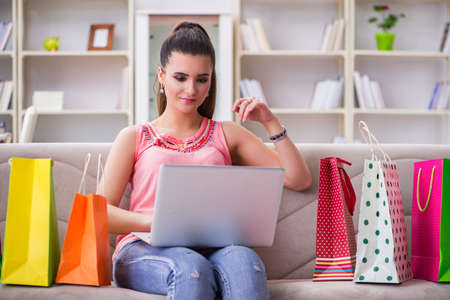 Young woman after shopping with bagsの写真素材