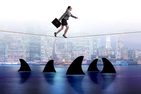 Hand cutting rope in business risk conceptの写真素材