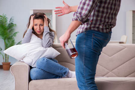 Domestic violence concept in a family argument with drunk alcohoの写真素材