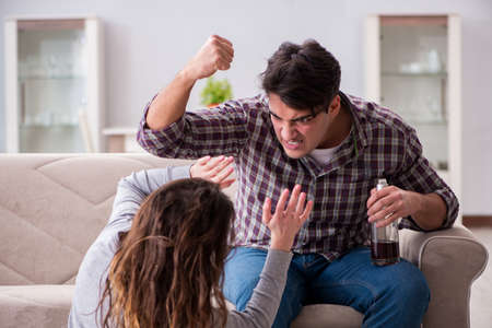 Domestic violence concept in a family argument with drunk alcohoの写真素材
