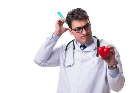 Young male cardiologist doctor holding a heart isolated on whiteの写真素材