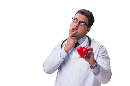 Young male cardiologist doctor holding a heart isolated on whiteの写真素材