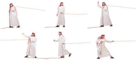 Arab in tug of war concept on whiteの写真素材