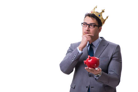King businessman holding a piggy bank isolated on white backgrouの写真素材