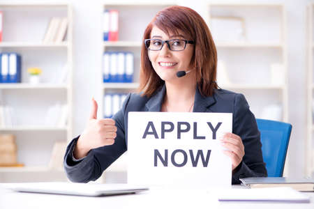 Businesswoman hiring new employees in officeの写真素材