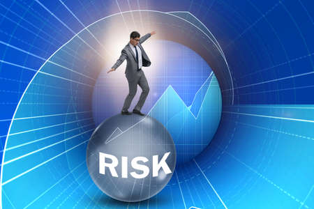 Young businessman in business risk and uncertainty conceptの写真素材