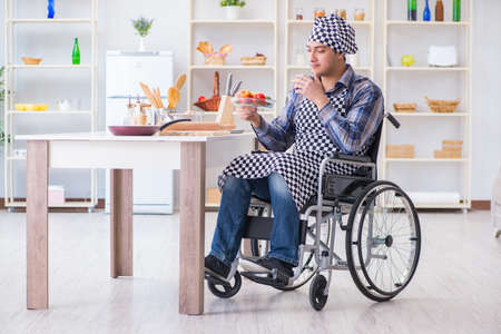 Young disabled husband preparing food saladの写真素材