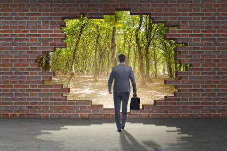 Businessman escaping for summer vacationの写真素材