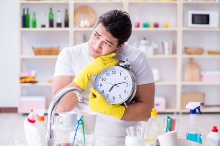 Man failing to meet the deadlines of housekeeping jobの写真素材