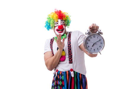 Funny clown with an alarm clock isolated on white backgroundの写真素材
