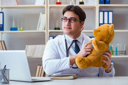 Doctor veterinary pediatrician holding an examination in the offの写真素材