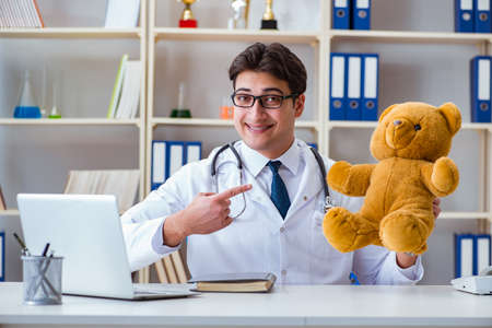 Doctor veterinary pediatrician holding an examination in the offの写真素材
