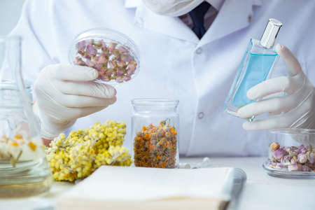 Chemist mixing perfumes in the lab