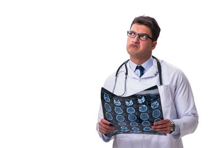 Young male doctor holding a radiograph isolated on white backgro