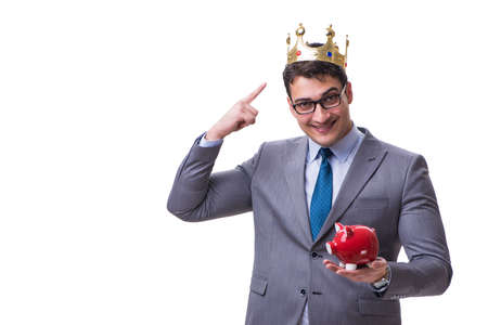 King businessman holding a piggy bank isolated on white backgrouの写真素材