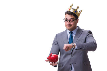 King businessman holding a piggy bank isolated on white backgrouの写真素材