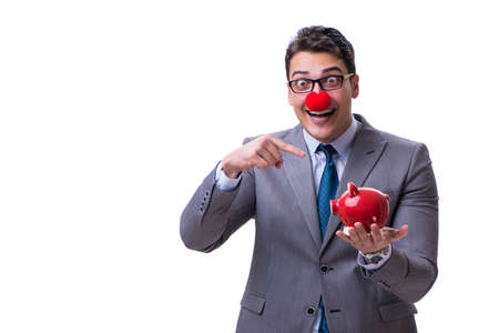 Funny clown businessman with a piggy bank isolated on white backの写真素材