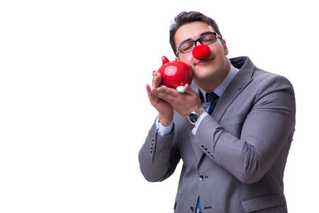 Funny clown businessman with a piggy bank isolated on white backの写真素材