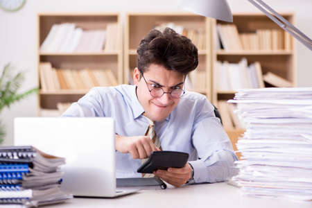 Funny accountant bookkeeper working in the officeの写真素材
