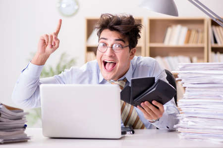 Funny accountant bookkeeper working in the officeの写真素材