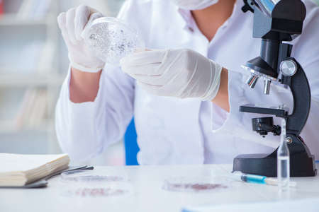 Female scientist researcher conducting an experiment in a laboratory