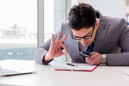 Man looking for errors and mistakes in reportの写真素材