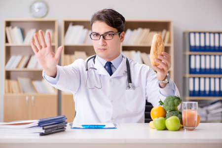 Scientist studying nutrition in various foodの写真素材