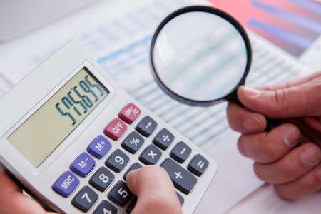 Finance analyst looking and financial reportsの写真素材