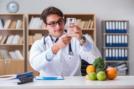 Scientist studying nutrition in various foodの写真素材