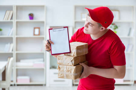 Post man delivering a parcel packageの写真素材