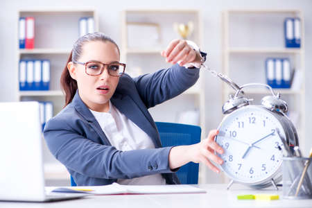 Businesswoman in time management conceptの写真素材