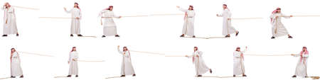 Arab in tug of war concept on whiteの写真素材