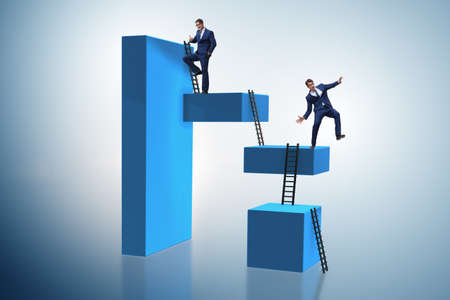 Businessman falling from high block in failure conceptの写真素材