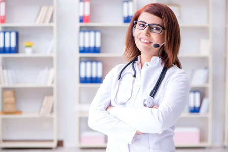 Woman doctor in telemedicine conceptの写真素材